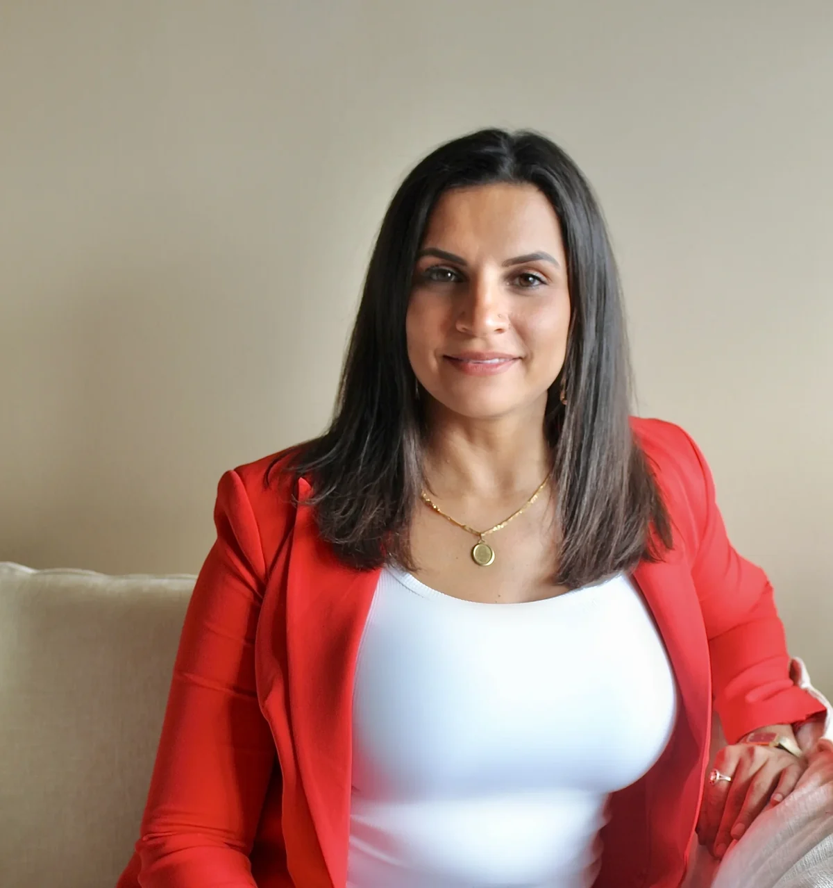 Christina Rose, Grief Mentor and speaker, in a red blazer